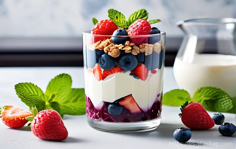 간단한 재료로 완성하는 건강 디저트 - **"Elegant Avocado Chocolate Mousse."**
    A sophisticated still-life featuring two clear, stemmed ...